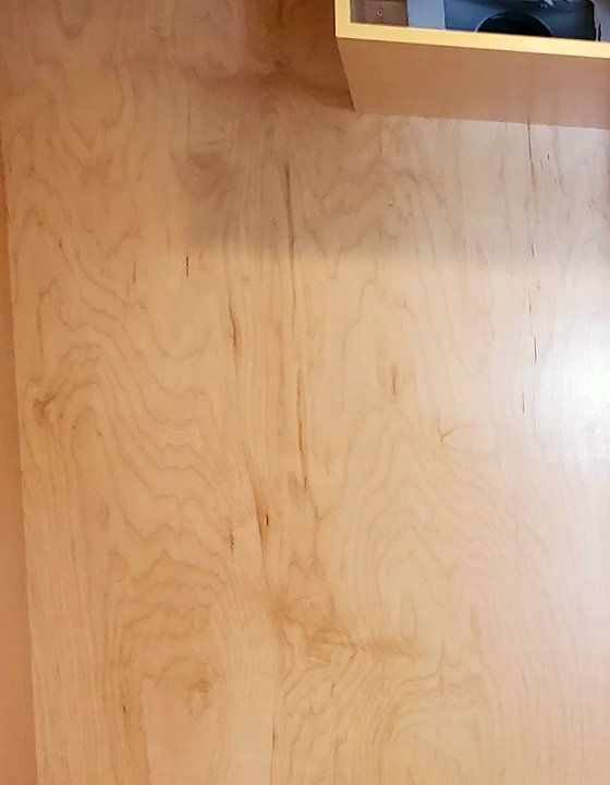 Pale maple panel inside a wardrobe, with soft, even grain